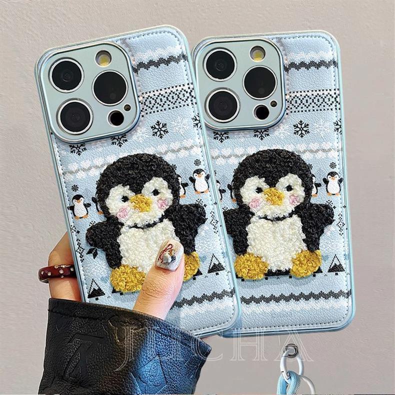 ペンギンが着ているセーター デザイン 、防振性能に優れ、高級感あふれる紐付きスマホケースで、iPhone に対応