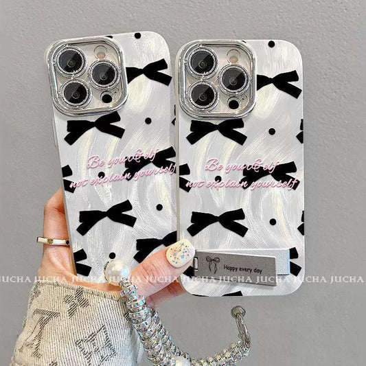 黒色のボウタイ  デザイン 、スマホケース 耐衝撃・防振性能に優れ、高級感あふれる紐付きスタンド付きスマホケースで、iPhone に対応