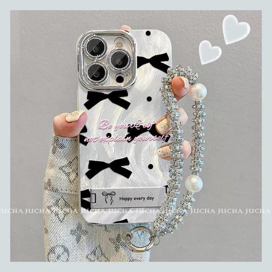 黒色のボウタイ  デザイン 、スマホケース 耐衝撃・防振性能に優れ、高級感あふれる紐付きスタンド付きスマホケースで、iPhone に対応