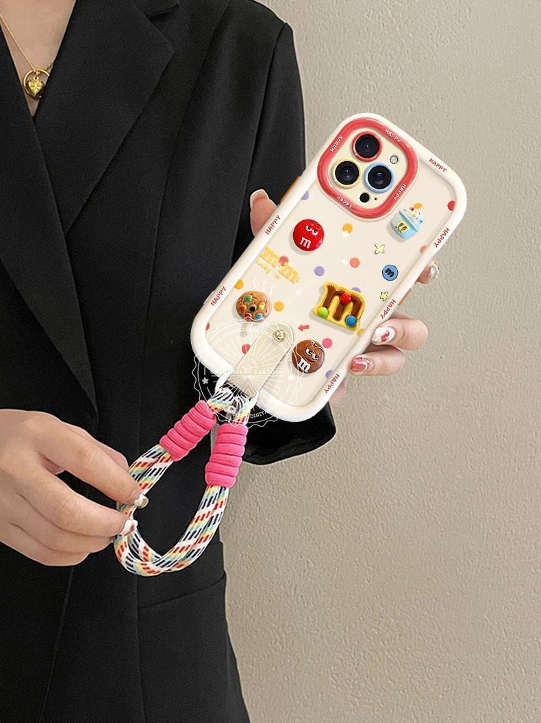 カラフルな立体的な M&M's のデザイン 高級感 あふれる 長短二種類の紐付き スマホケース iPhone に対応