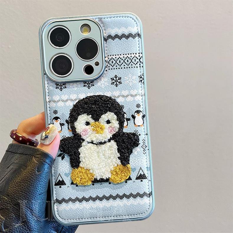ペンギンが着ているセーター デザイン 、防振性能に優れ、高級感あふれる紐付きスマホケースで、iPhone に対応