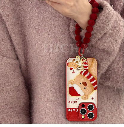 A small bear with a scarf design. Made of silicone, it is highly shock-resistant and has a luxurious look. Smartphone case with a string, compatible with iPhones.