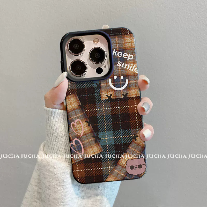 A luxurious smartphone case with a checkered, happy smiling face design, excellent shock and vibration resistance, and compatible with iPhones.