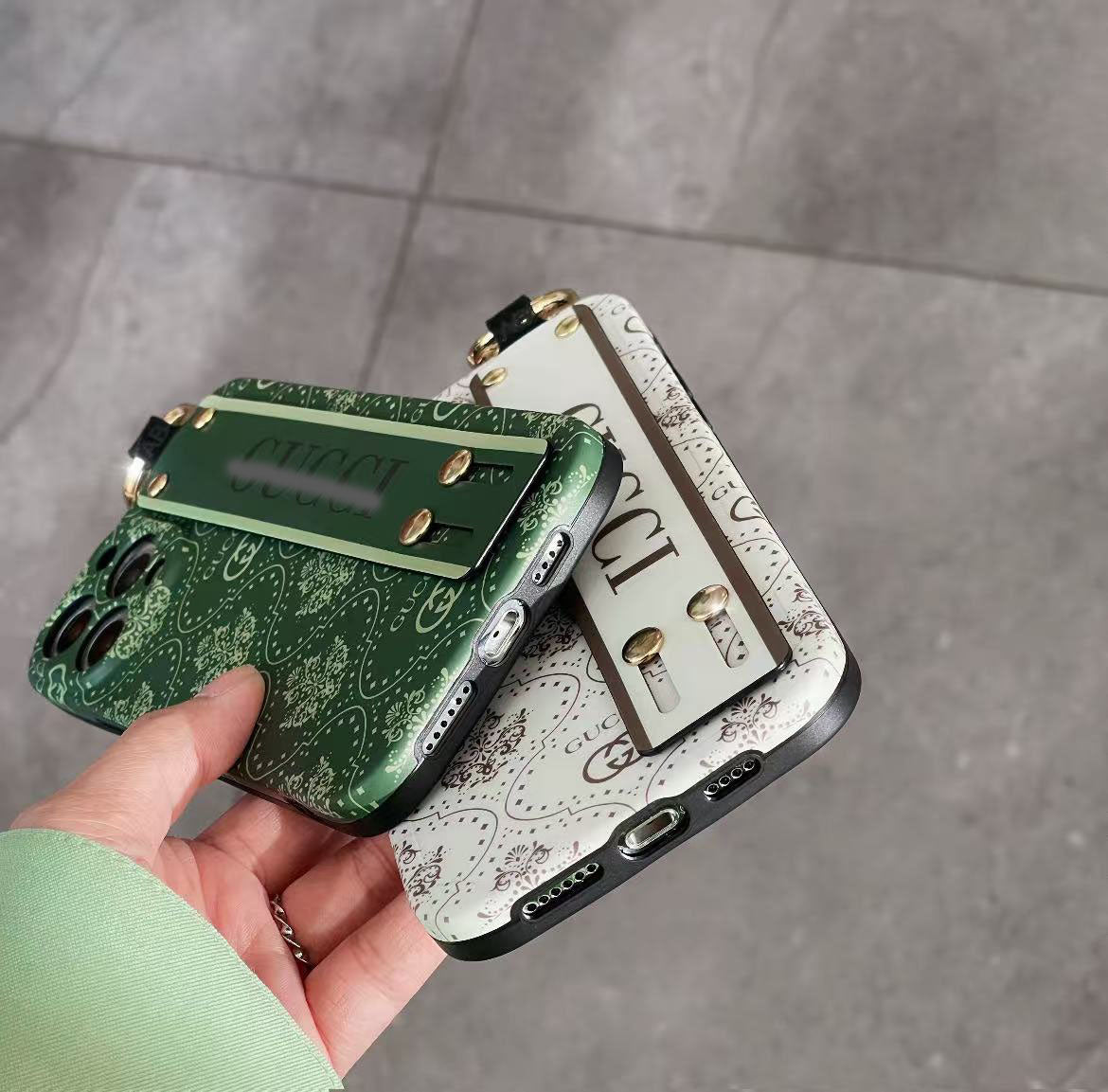 スマホケース  高級感 腕バンド付き  ダブルG 耐衝撃・防振性能に優れ、高級感あふれるスマホケースで、iPhone に対応