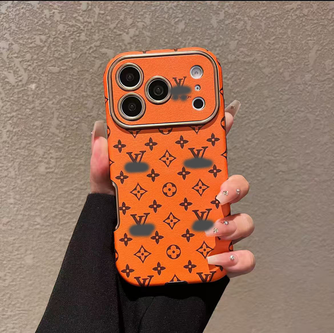 スマホケース  高級感オレンジ色の皮革製スマホケース   ダブルV    耐衝撃・防振性能に優れ、高級感あふれるスマホケースで、iPhone13~17 に対応