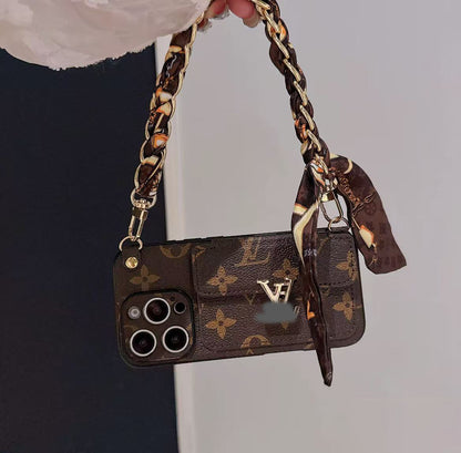 スマホケース  高級感ストラップ付き＋スカーフ付きスマホケース ダブルV   耐衝撃・防振性能に優れ、高級感あふれるスマホケースで、 iPhone12~17 に対応