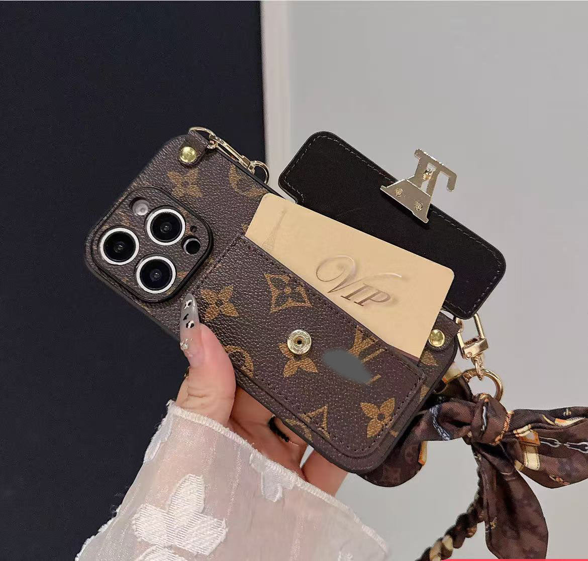 スマホケース  高級感ストラップ付き＋スカーフ付きスマホケース ダブルV   耐衝撃・防振性能に優れ、高級感あふれるスマホケースで、 iPhone12~17 に対応