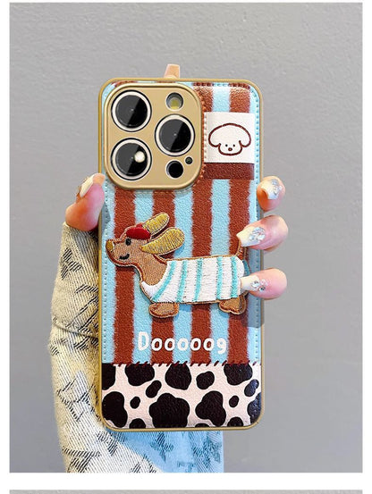 A luxurious smartphone case with a striped embroidered dog design and a drawstring that is compatible with iPhones