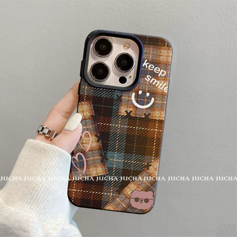 A luxurious smartphone case with a checkered, happy smiling face design, excellent shock and vibration resistance, and compatible with iPhones.