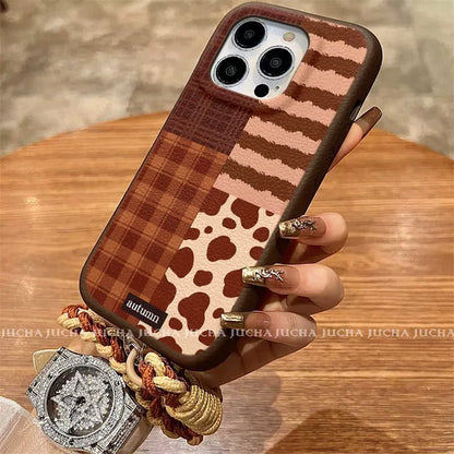 A luxurious smartphone case with a patchwork check pattern design, excellent shock and vibration resistance, and compatible with iPhones.