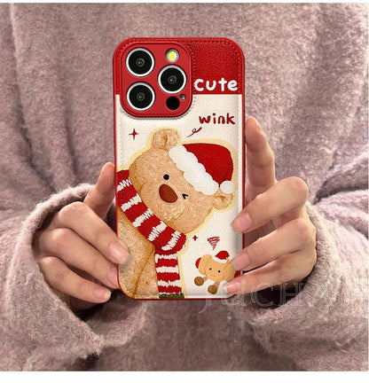 A small bear with a scarf design. Made of silicone, it is highly shock-resistant and has a luxurious look. Smartphone case with a string, compatible with iPhones.