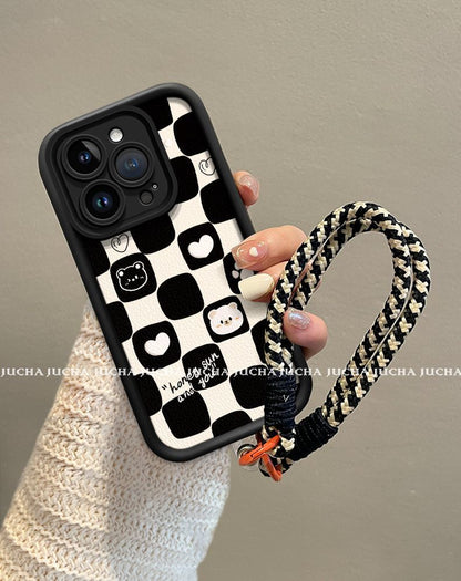 A black and white heart-shaped bear design, excellent shock and vibration resistance, and a luxurious smartphone case with a string that is compatible with iPhones