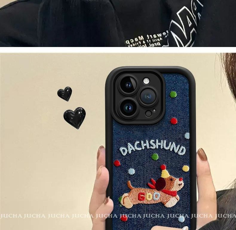 A luxurious smartphone case made of denim material with embroidered dogs. Compatible with iPhones.