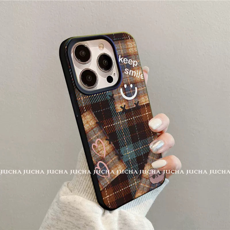 A luxurious smartphone case with a checkered, happy smiling face design, excellent shock and vibration resistance, and compatible with iPhones.