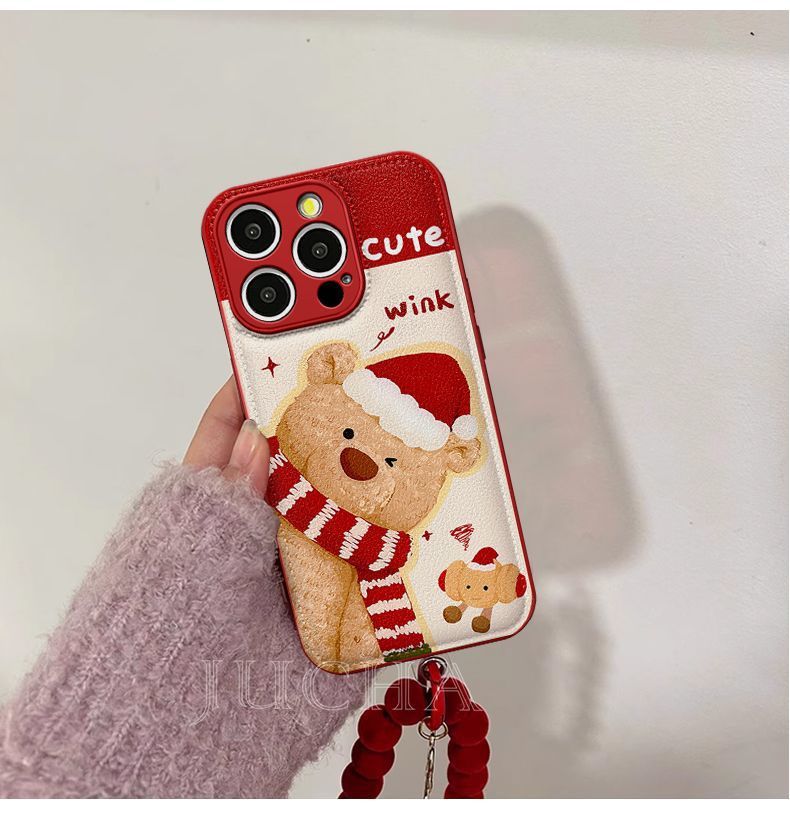 A small bear with a scarf design. Made of silicone, it is highly shock-resistant and has a luxurious look. Smartphone case with a string, compatible with iPhones.