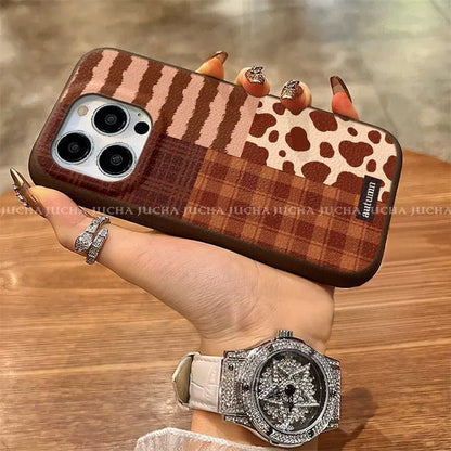 A luxurious smartphone case with a patchwork check pattern design, excellent shock and vibration resistance, and compatible with iPhones.