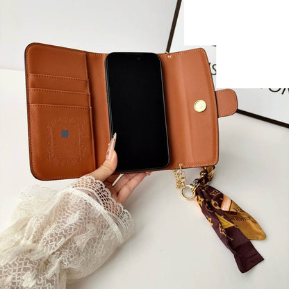 #525  スマホケース  リボンブレスレット付き カード収納付き  耐衝撃・防振性能に優れ、iPhoneに対応