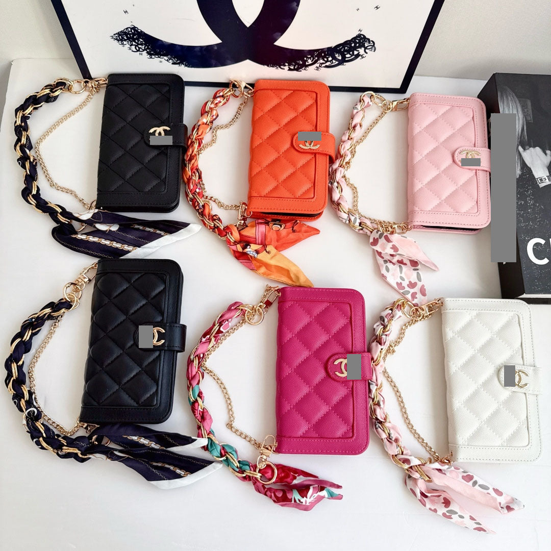 #540  スマホケース  リボンブレスレット付き カード収納付き  耐衝撃・防振性能に優れ、iPhoneに対応